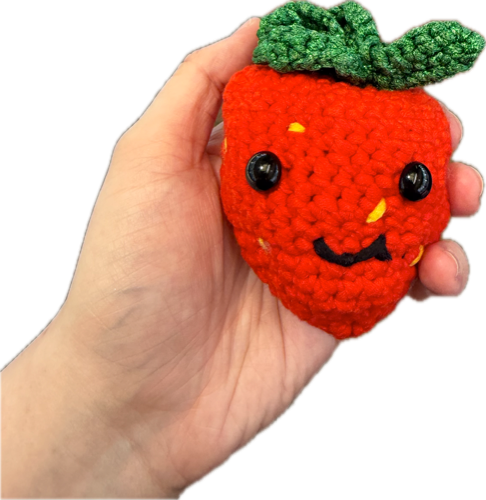 Crocheted amigurumi strawberry
